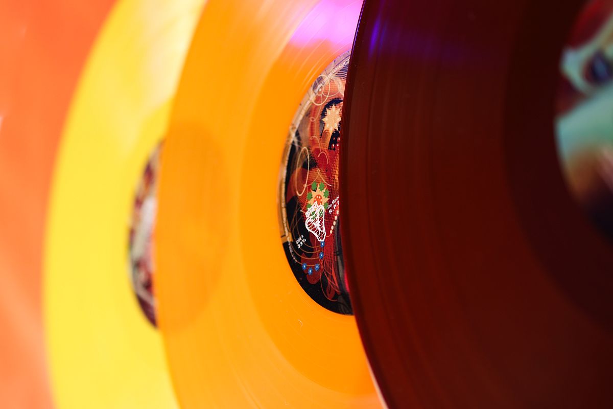 Closeup photo of yellow, orange and red colour vinyl variants from the Gorillaz' The Mountain